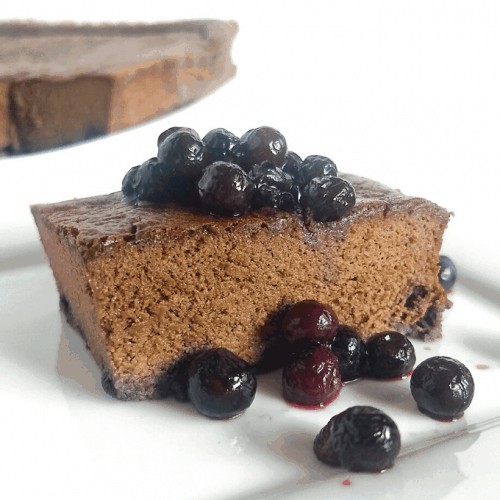 finished cake on plate with blueberries