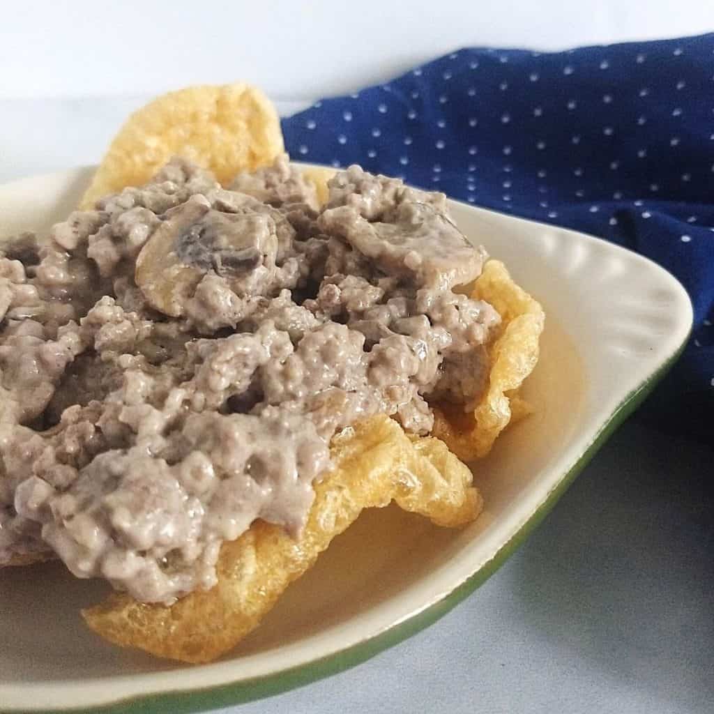 ground beef stroganoff on a bed of pork rinds