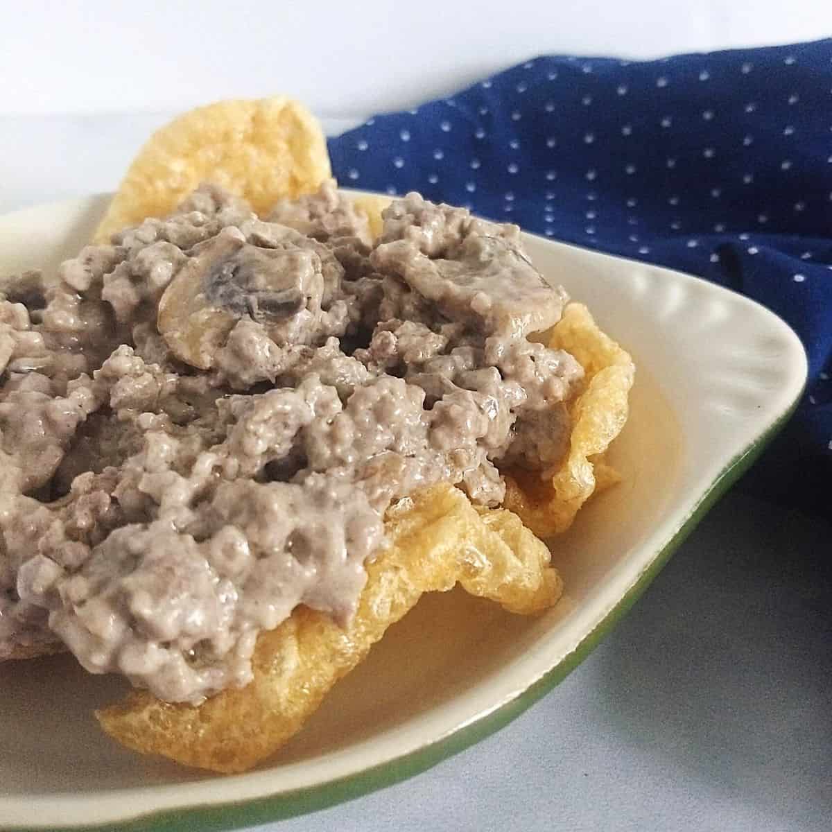 ground beef stroganoff on a bed of pork rinds