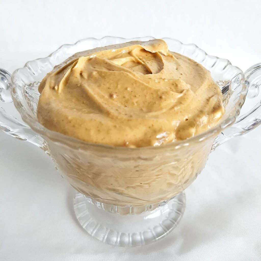 Peanut Butter Frosting in a clear dish.