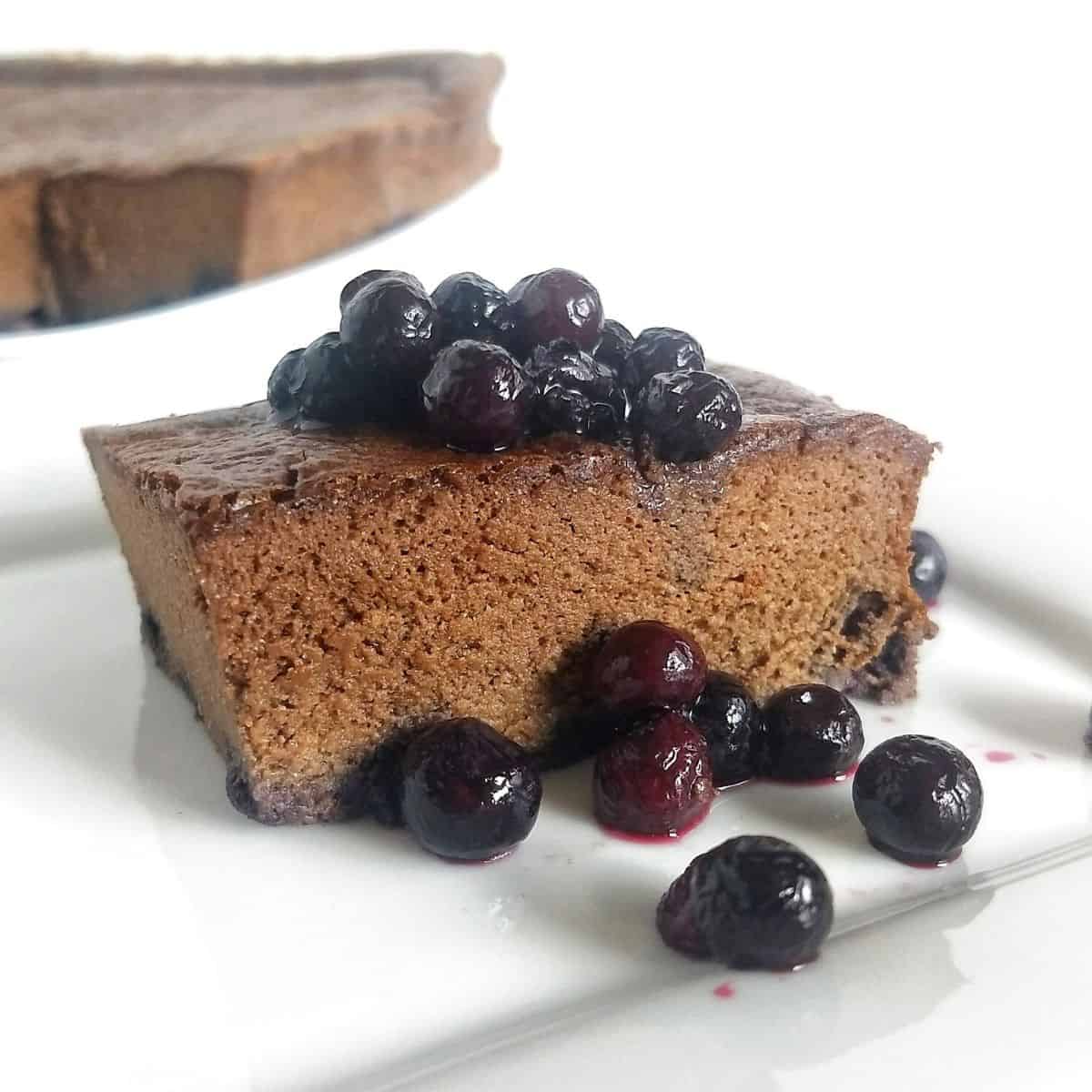 square piece of blueberry chocolate cake