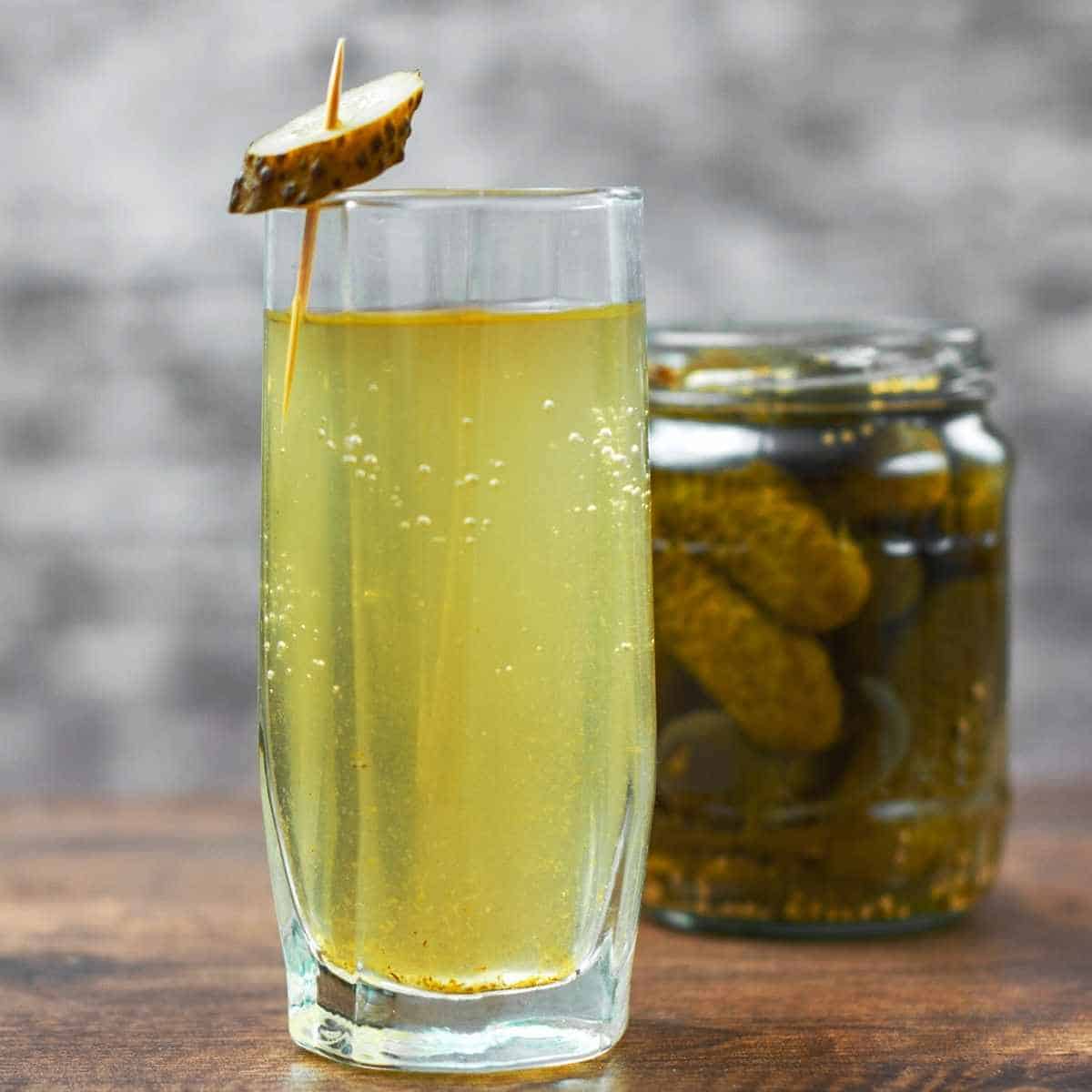 glass of pickle juice - How to Fix Whole Body Aches on Keto: Advice from a Nutritionist