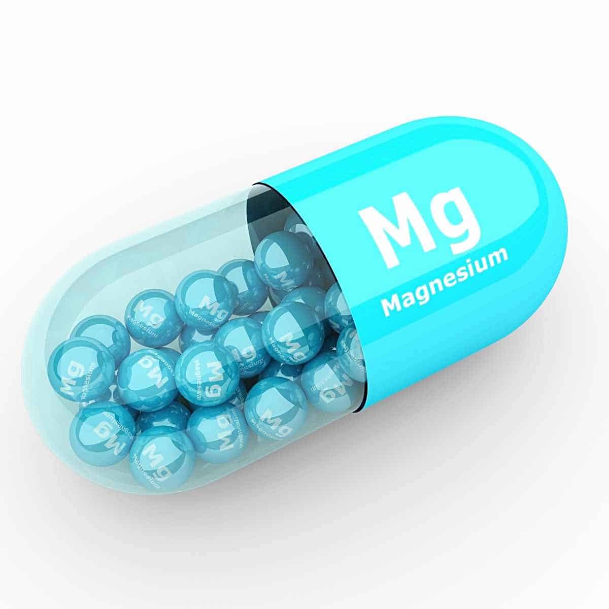 pills of magnesium in a big pill - How to Fix Whole Body Aches on Keto: Advice from a Nutritionist