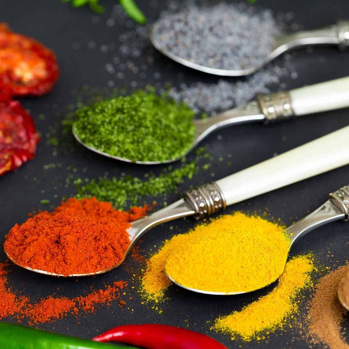 36 Herbs And Spices That Are Keto Friendly spoons filled with spices - 36 Herbs And Spices That Are Keto Friendly