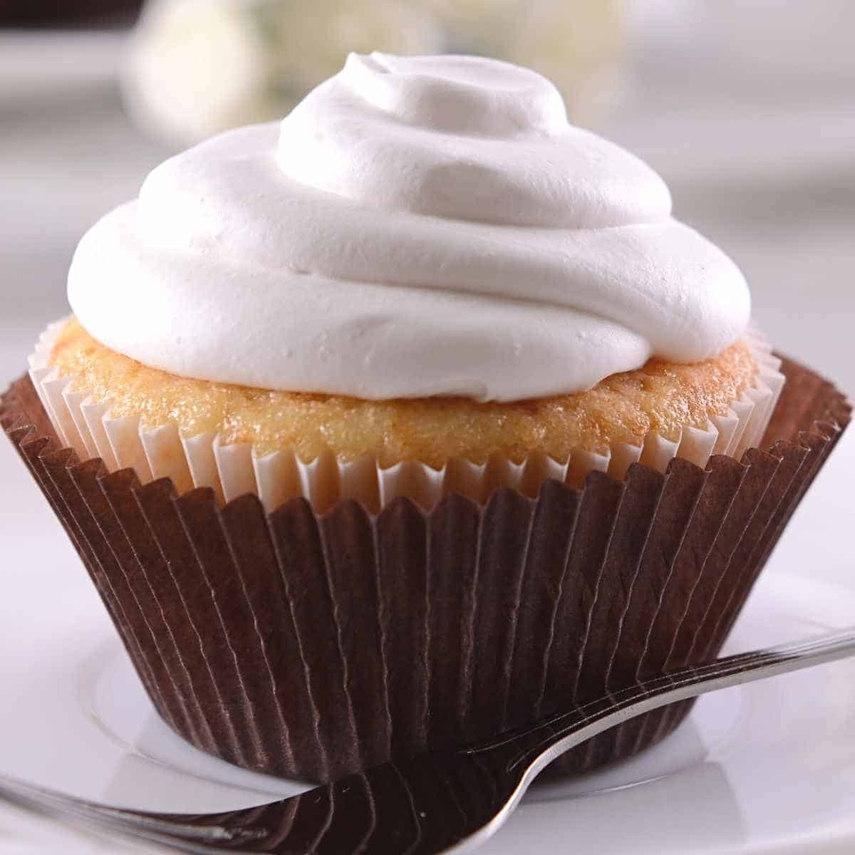 white frosting on cupcake