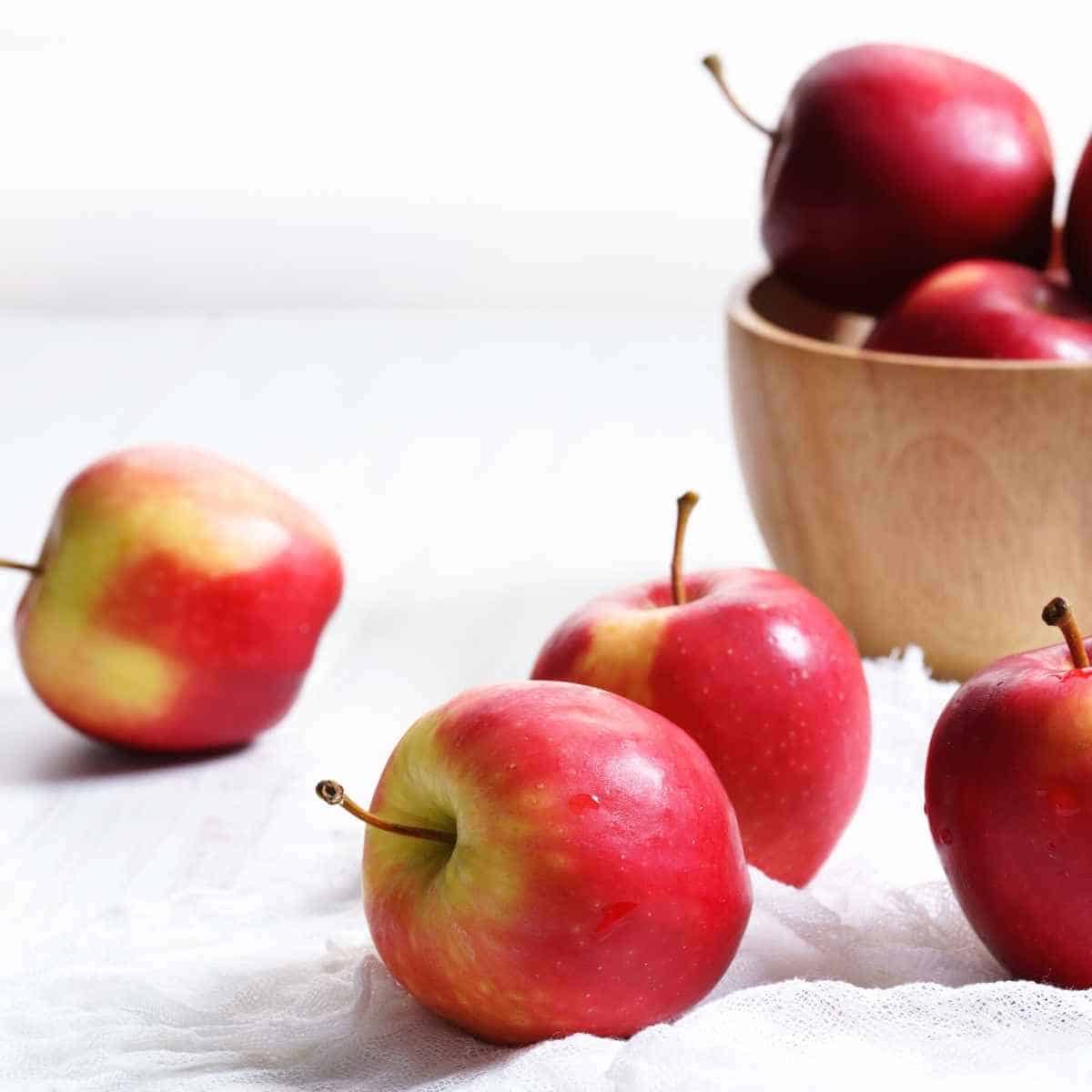 apples falling out of a basket - Are Apples Keto Friendly? | Total Carbs | Alternatives