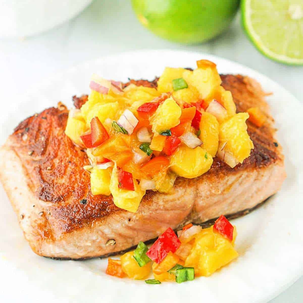 mango salsa over salmon - The Complete Guide to Mangoes on Keto