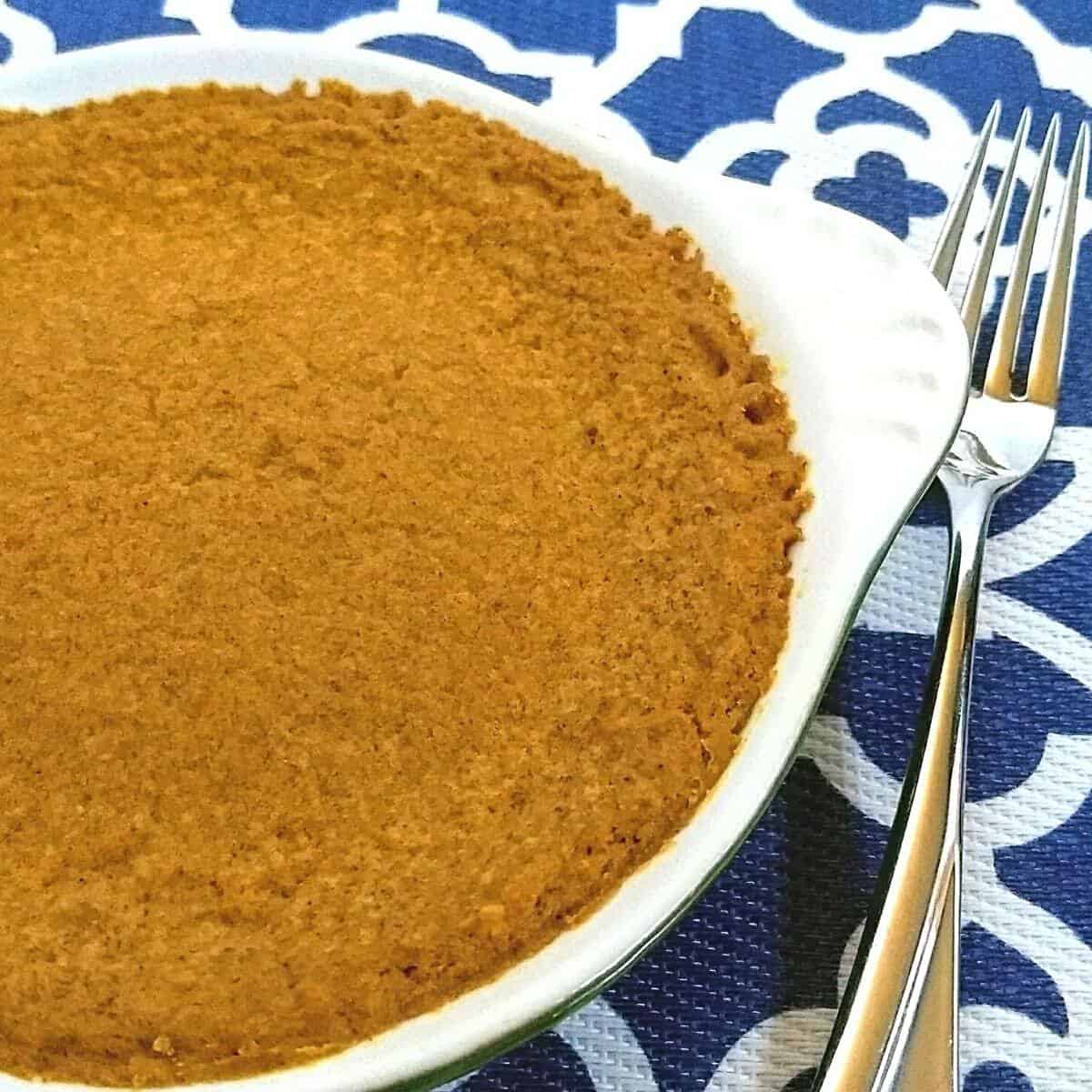 pumpkin pie with a fork to the right of it