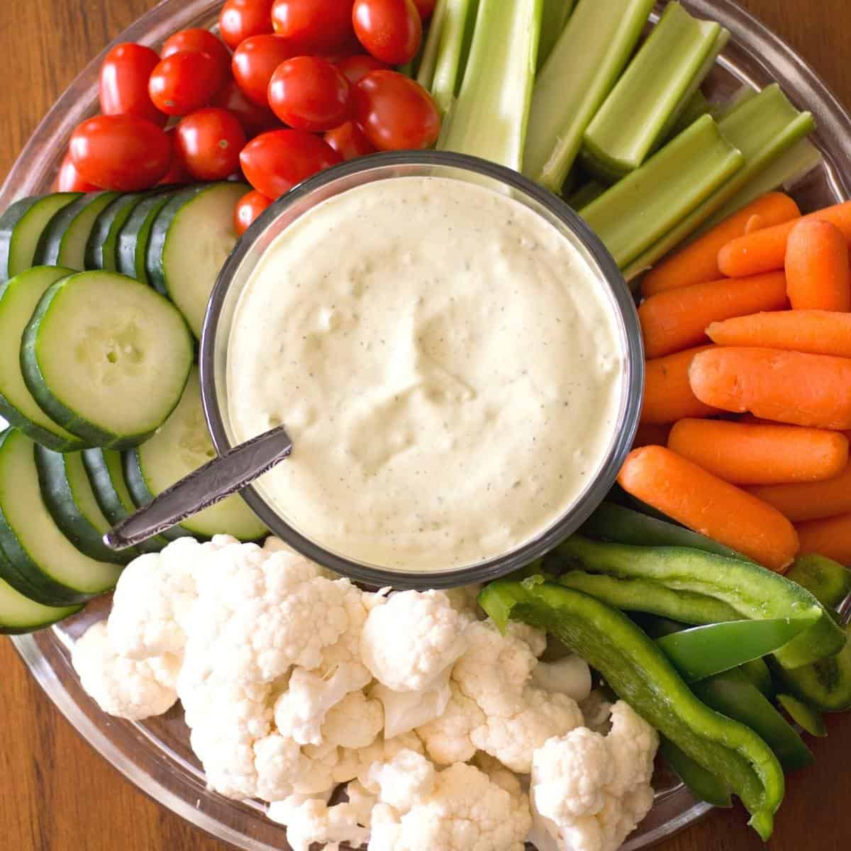 circle platter of low carb veggies with dip in the middle