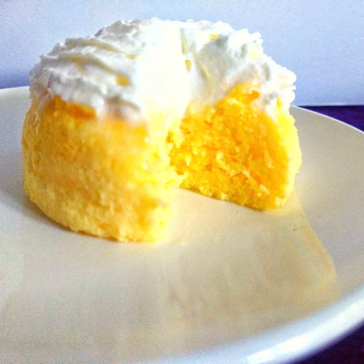 small lemon cake with frosting on top