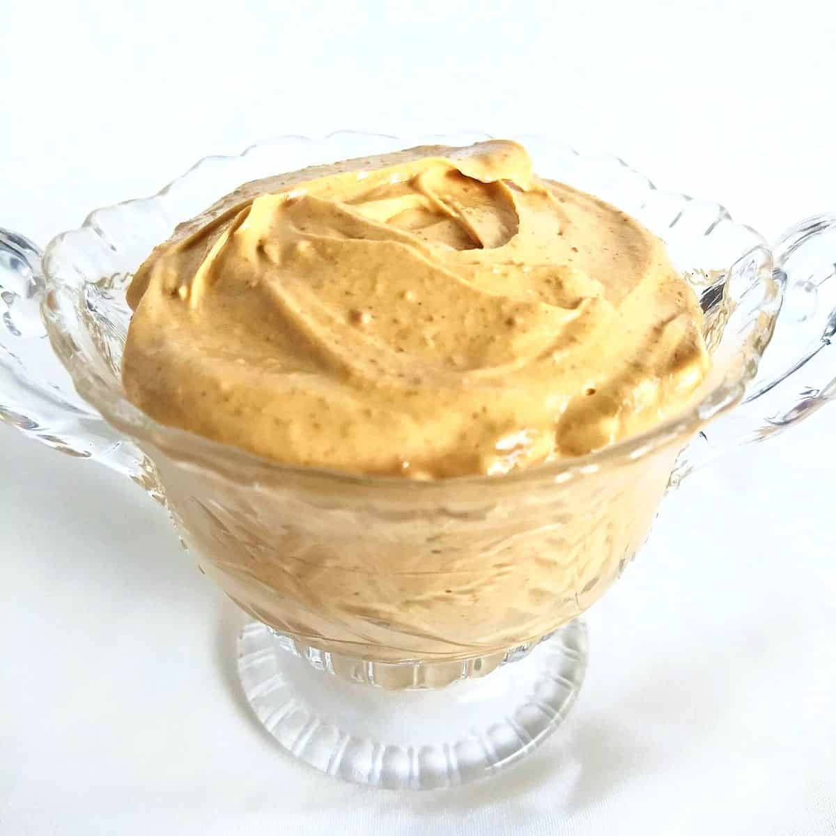 peanut butter frosting in a clear dish